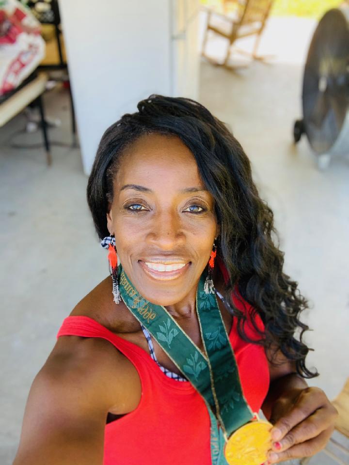 Ruthie Bolton with Olympic gold medal